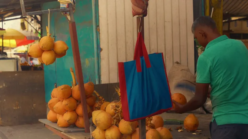 Orange king coconuts at a Colombo stall